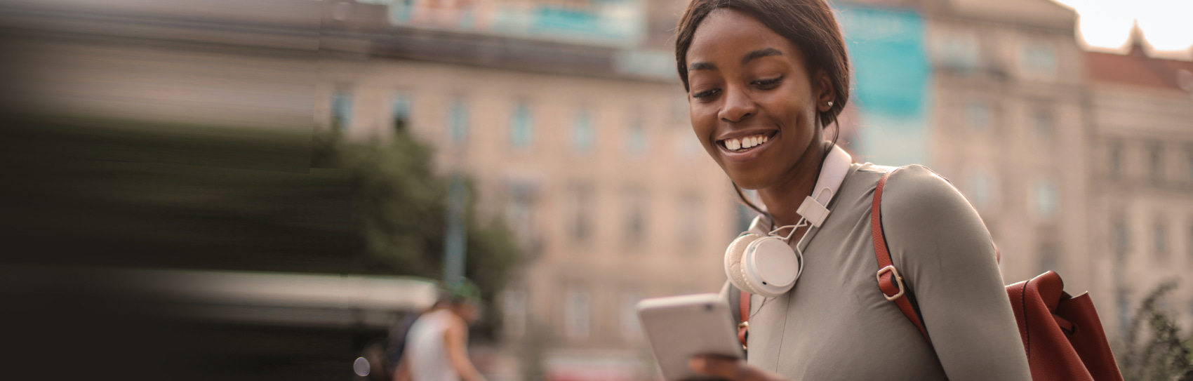 Woman Learning To Trade Forex On Her Phone With A Forex Demo Account | FXTM